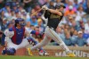 Pittsburgh Pirates' Brandon Lowe, right, watches his two-RBI single hit during the sixth inning of a baseball game against the Chicago Cubs, Sunday, Sept. 13, 2026, in Chicago. (AP Photo/Melissa Tamez)