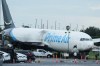 Workers inspect an Amazon cargo plane that overshot a runway four days ago at Miami International Airport, Thursday, Sept. 10, 2026, in Miami. (AP Photo/Marta Lavandier)
