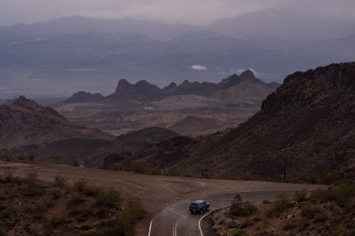 FILE - A car drives along Oatman Highway on historic Route 66, near Oatman, Ariz., on Friday, Nov. 21, 2025. (AP Photo/Jae C. Hong, File)