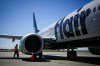 Flair Airlines captain Ken Symonds inspects the outside of one of the company's Boeing 737 Max 8 aircraft while parked at a gate at Vancouver International Airport, in Richmond, B.C., on Wednesday, April 17, 2024. THE CANADIAN PRESS/Darryl Dyck