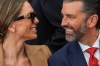 Donald Trump Jr. and his wife Bettina Anderson look at each other while waiting for President Donald Trump to speak at Deerfield Residence, the residence of the U.S. Ambassador to Ireland Edward S. Walsh, Saturday, Sept. 12, 2026, in Dublin. (AP Photo/Julia Demaree Nikhinson)