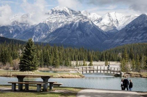 Visitors explore Cascade Ponds in Banff National Park, Alta., Thursday, May 15, 2025. THE CANADIAN PRESS/Jeff McIntosh