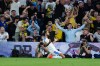 Leeds United's Dominic Calvert-Lewin celebrates scoring during the English Premier League soccer match between Leeds United and Newcastle United in Leeds, England, Monday Sept. 14, 2026. (Annabel Lee-Ellis/PA via AP)