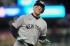 New York Yankees' Aaron Judge celebrates while running the bases after hitting a three-run home run during the eighth inning of a baseball game against the Minnesota Twins, Monday, Sept. 14, 2026, in Minneapolis. (AP Photo/Abbie Parr)