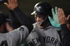 New York Yankees' Aaron Judge celebrates in the dugout after hitting a three-run home run during the eighth inning of a baseball game against the Minnesota Twins, Monday, Sept. 14, 2026, in Minneapolis. (AP Photo/Abbie Parr)