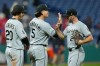 Chicago White Sox's Miguel Vargas (20), Munetaka Murakami (5) and Tristan Peters, right, celebrate after the White Sox defeated the Cleveland Guardians in a baseball game in Cleveland, Monday, Sept. 14, 2026. (AP Photo/Sue Ogrocki)