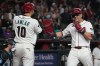 Arizona Diamondbacks' Lars Nootbaar, right, celebrates with center fielder Jordan Lawlar (10) after hitting a two-run home run against the Miami Marlins in the third inning of a baseball game, Monday, Sept 14, 2026, in Phoenix. (AP Photo/Rick Scuteri)