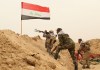 FILE - Fighters from the Badr Brigades Shiite militia clash with an Islamic State militant group at the front line on the outskirts of Fallujah in the Anbar province of Iraq, June 1, 2015. (AP Photo/Hadi Mizban, File)