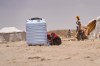 Displaced Yemenis collect water at Al-Firdaws camp in Ras Imran, just outside Aden, Yemen, Monday, Sept. 14, 2026. (AP Photo/Abdulnasser Alseddik)