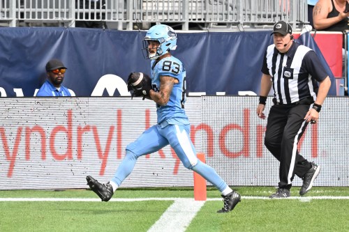 Toronto Argos wide receiver David Ungerer (83) scores a touchdown against the Ottawa Redblacks during second half CFL football action in Toronto on Saturday, Sept. 12, 2026. THE CANADIAN PRESS/Jon Blacker