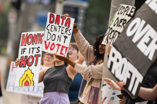 People in opposition to AI data centres demonstrate outside city hall in Hamilton, Wednesday, July 15, 2026. THE CANADIAN PRESS/Nick Iwanyshyn