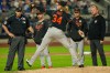 Baltimore Orioles manager Craig Albernaz, second from left, and others watch as pitcher Shane Baz, center, tests his arm after he was hit by a ball during the fifth inning of a baseball game against the New York Mets, Tuesday, Sept. 15, 2026, in New York. (AP Photo/Seth Wenig)