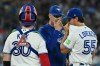 Toronto Blue Jays pitching coach Pete Walker visits pitcher Michael Lorenzen (55) and catcher Alejandro Kirk (30) on the mound during fourth inning MLB baseball action against the Detroit Tigers in Toronto on Tuesday, Sept. 15, 2026. THE CANADIAN PRESS/Jon Blacker