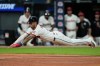 Cleveland Guardians' Brayan Rocchio dives for home plate in the fifth inning of a baseball game against the Chicago White Sox in Cleveland, Tuesday, Sept. 15, 2026. (AP Photo/Sue Ogrocki)