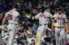 Atlanta Braves' Ronald Acuña Jr., center, celebrates with Matt Olson, left, and Drake Baldwin after hitting a two-run home run during the sixth inning of a baseball game against the Chicago Cubs in Chicago, Tuesday, Sept. 15, 2026. (AP Photo/Nam Y. Huh)