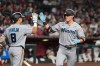Miami Marlins' Griffin Conine, right, celebrates his home run against the Arizona Diamondbacks with Marlins' Javier Sanoja (8) during the fourth inning of a baseball game, Tuesday, Sept. 15, 2026, in Phoenix. (AP Photo/Ross D. Franklin)
