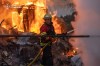 In this photo provided by the Ukrainian Emergency Service, firefighters put out a fire at private homes following a Russian air attack in Sumy, Ukraine, Wednesday, Sept. 16, 2026. (Ukrainian Emergency Service via AP)