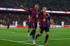 Barcelona's Raphinha celebrates with Gavi, right, after scoring his side's fifth goal from the penalty spot during a Spanish La Liga soccer match between Barcelona and Racing de Santander in Barcelona, Spain, Wednesday, Sept. 16, 2026. (AP Photo/Joan Monfort)