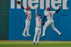 Cleveland Guardians left fielder Steven Kwan, left, center fielder Petey Halpin, center, and right fielder Jo Adell (7) celebrate after the Guardians defeated the Chicago White Sox in a baseball game in Cleveland, Wednesday, Sept. 16, 2026. (AP Photo/Sue Ogrocki)