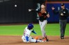 Baltimore Orioles' Jackson Holliday (7) throws out New York Mets' Bo Bichette at first base after foercing out Francisco Lindor (12) for a double play during the first inning of a baseball game Monday, Sept. 14, 2026, in New York. (AP Photo/Frank Franklin II)