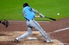 Milwaukee Brewers' Christian Yelich hits a single off Pittsburgh Pirates pitcher Carmen Mlodzinski, driving in two runs, during the seventh inning of a baseball game in Pittsburgh, Wednesday, Sept. 16, 2026. (AP Photo/Gene J. Puskar)