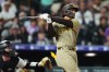 San Diego Padres catcher Ethan Salas watches his two-run home run off Colorado Rockies relief pitcher Nick Frasso in the fifth inning of a baseball game Wednesday, Sept. 16, 2026, in Denver. (AP Photo/David Zalubowski)