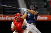Seattle Mariners designated hitter Dominic Canzone (8) hits an RBI single during the sixth inning of a baseball game against the Los Angeles Angels, Wednesday, Sept. 16, 2026, in Anaheim, Calif. (AP Photo/Caroline Brehman)