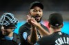 Miami Marlins pitcher Sandy Alcantara, left, celebrates a win against the Arizona Diamondbacks with Marlins manager Clayton McCullough after a baseball game, Wednesday, Sept. 16, 2026, in Phoenix. (AP Photo/Ross D. Franklin)