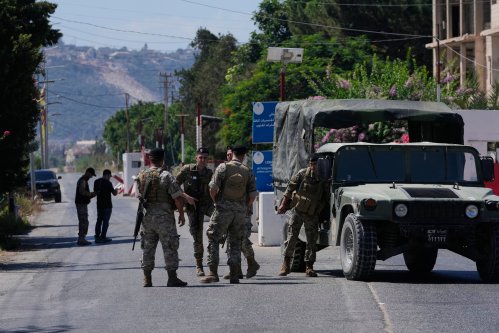 Lebanese army soldiers stand guard at a checkpoint near the border with Israel in the southern village of Mansouri, Lebanon, Friday, Sept. 4, 2026. (AP Photo/Mohammed Zaatari)
