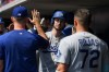 Los Angeles Dodgers' Kyle Tucker celebrates in the dugout after hitting a two-run home run during the first inning of a baseball game against the Cincinnati Reds, Thursday, Sept. 17, 2026 in Cincinnati. (AP Photo/Tanner Pearson)