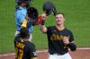 Pittsburgh Pirates' Henry Davis, right, celebrates with Ronny Simon (63) after hitting a two-run home run in the eighth inning of a baseball game against the Milwaukee Brewers in Pittsburgh, Thursday, Sept. 17, 2026. (AP Photo/Gene J. Puskar)