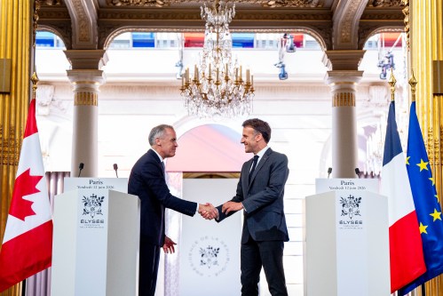 Canadian Prime Minister Mark Carney, left, and French President Emmanuel Macron shake hands after giving remarks at the Palais de l’Elysee in Paris, on Friday, June 12, 2026. THE CANADIAN PRESS/Christopher Katsarov