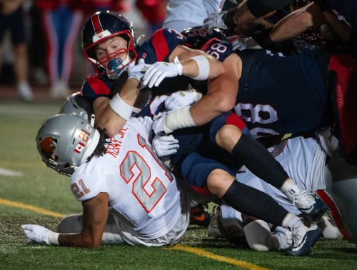 Montreal Alouettes' Liam Talbot (30) scores a touchdown as B.C. Lions' Ronald Kent Jr. (21) defends during second half CFL football action in Montreal, Friday, Sept. 4, 2026. THE CANADIAN PRESS/Peter McCabe