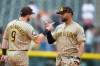 San Diego Padres second baseman Jake Cronenworth, left, celebrates with shortstop Xander Bogaerts, right, after their team defeated the Colorado Rockies in a baseball game Thursday, Sept. 17, 2026, in Denver. (AP Photo/David Zalubowski)