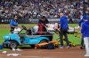 New York Mets first baseman Jared Young is brought off the field on a stretcher after colliding with pitcher Nolan McLean during the sixth inning of a baseball game against the Philadelphia Phillies, Thursday, Sept. 17, 2026, in New York. (AP Photo/Seth Wenig)