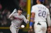 Boston Red Sox's Trevor Story celebrates his three-run home run as he jogs past Texas Rangers' Ezequiel Duran (20) in the eighth inning of a baseball game Thursday, Sept. 17, 2026, in Arlington, Texas (AP Photo/Tony Gutierrez)