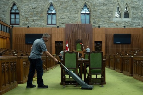 A maintenance worker vacuums the carpet in the House of Commons in Ottawa on Thursday, Sept. 17, 2026. THE CANADIAN PRESS/Adrian Wyld
