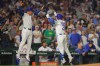 Chicago Cubs' Alex Bregman, right, celebrates his home run with third base coach Quintin Berry, left, during the fourth inning of a baseball game against the Atlanta Braves, Wednesday, Sept. 16, 2026, in Chicago. (AP Photo/Melissa Tamez)