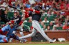 Washington Nationals' CJ Abrams, right, follows through on an RBI single during the first inning of a baseball game against the St. Louis Cardinals, Friday, Sept. 18, 2026, in St. Louis. (AP Photo/Scott Kane)