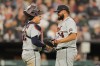 Detroit Tigers' Eduardo Valencia, left, celebrates with Kenley Jansen, right, after a baseball game against the Chicago White Sox, Friday, Sept. 18, 2026, in Chicago. (AP Photo/Melissa Tamez)
