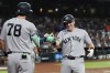 New York Yankees' Ben Rice, right, celebrates his home run against the Arizona Diamondbacks with Yankees' Spencer Jones (78) during the third inning of a baseball game, Friday, Sept. 18, 2026, in Phoenix. (AP Photo/Ross D. Franklin)