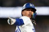 Los Angeles Dodgers' Mookie Betts gestures after hitting a two-run home run during the eighth inning of a baseball game against the San Francisco Giants, Friday, Sept. 18, 2026, in Los Angeles. (AP Photo/Mark J. Terrill)