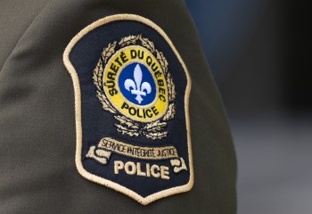 A Quebec provincial police shoulder patch is seen in Montreal, on Sept. 10, 2024. THE CANADIAN PRESS/Christinne Muschi
