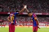 Barcelona's Raphinha, right, celebrates with Lamine Yamal after scoring his side's second goal the Spanish La Liga soccer match between Sevilla and Barcelona in Seville, Spain, Saturday, Sept. 19, 2026. (AP Photo/Jose Breton)