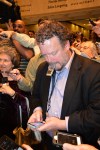 In this photo provided by the State Archives of Florida, Associated Press reporter Brendan Farrington clasps his digital recorder between his lips while using his cellphone during a press gaggle with Gov. Rick Scott on May 1, 2014, at the Florida State Capitol in Tallahassee, Fla. (Bill Cotterell/State Archives of Florida via AP)