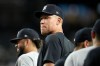 Injured New York Yankees' Aaron Judge pauses on the field after a baseball game against the Arizona Diamondbacks, Friday, Sept. 18, 2026, in Phoenix. (AP Photo/Ross D. Franklin)