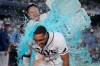 Tampa Bay Rays' Richie Palacios, front, gets doused by Taylor Walls after Palacios hit a walk off single off Boston Red Sox pitcher Garrett Whitlock during the ninth inning of a baseball game Saturday, Sept. 19, 2026, in St. Petersburg, Fla. (AP Photo/Chris O'Meara)