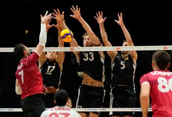 Canada's Stephen Timothy Maar (7) spikes the ball against the block of Germany's Jan Zimmermann (17), Simon Valentin Torwie (33) and Moritz Reichert (5), in Volleyball Nations League action in Ottawa, on Wednesday, June 10, 2026. THE CANADIAN PRESS/Justin Tang