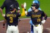 Pittsburgh Pirates' Jake Mangum (28) celebrates with Nick Gonzales (3) after hitting a two-run home run off Kansas City Royals pitcher Noah Cameron during the fourth inning of a baseball game in Pittsburgh, Saturday, Sept. 19, 2026. (AP Photo/Gene J. Puskar)