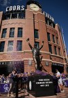 The Colorado Rockies unveil a bronze statue of franchise icon and Hall of Famer Todd Helton outside Coors Field in Denver, Saturday, Sept. 19, 2026. (AP Photo/RJ Sangosti)
